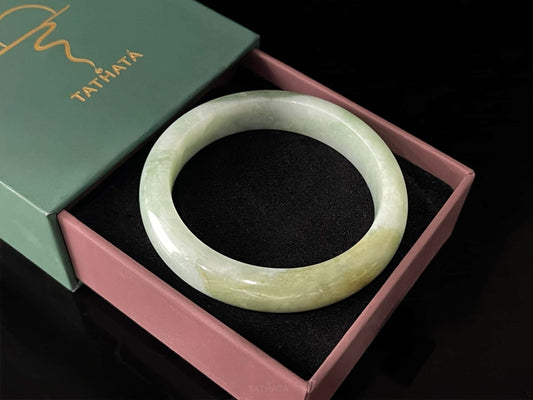 A frosted fern hue jadeite bangle.