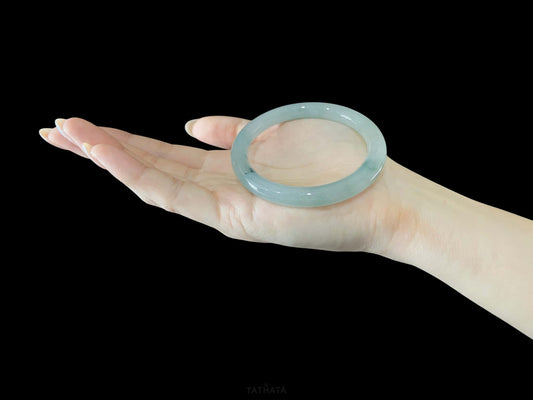 A floating blue ink jadeite bangle.