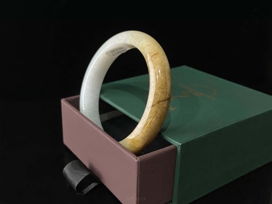 A sundrop amber glow jadeite bangle.