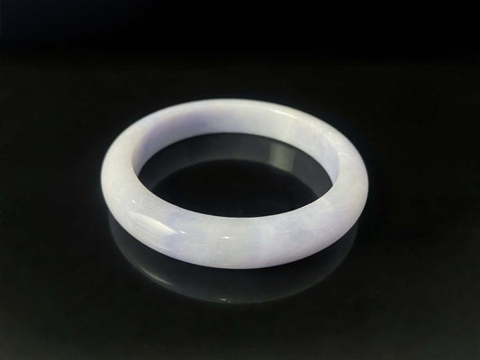 A purple mist shade jadeite bangle.