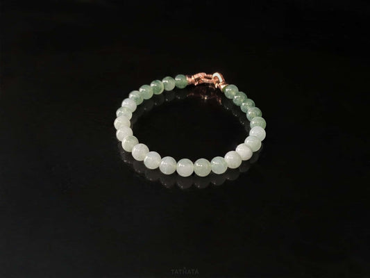 A floating green gradient jadeite beads bracelet.