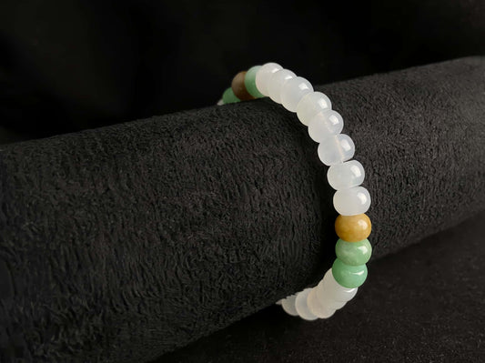 A golden green white blessing jadeite beads bracelet.