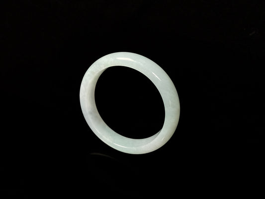 A pale white green mist jadeite bangle.