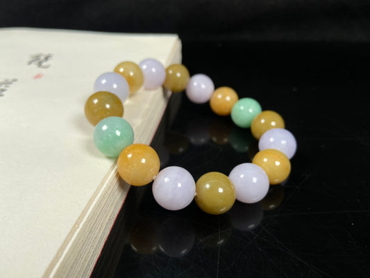 A yellow green purple jadeite beads bracelet.