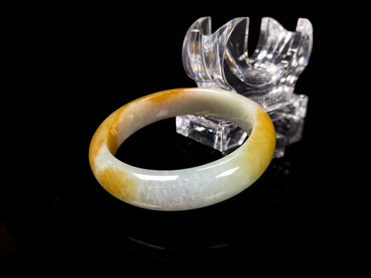 A honeyed frost jadeite bangle.