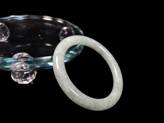 A dewy green jadeite bangle.