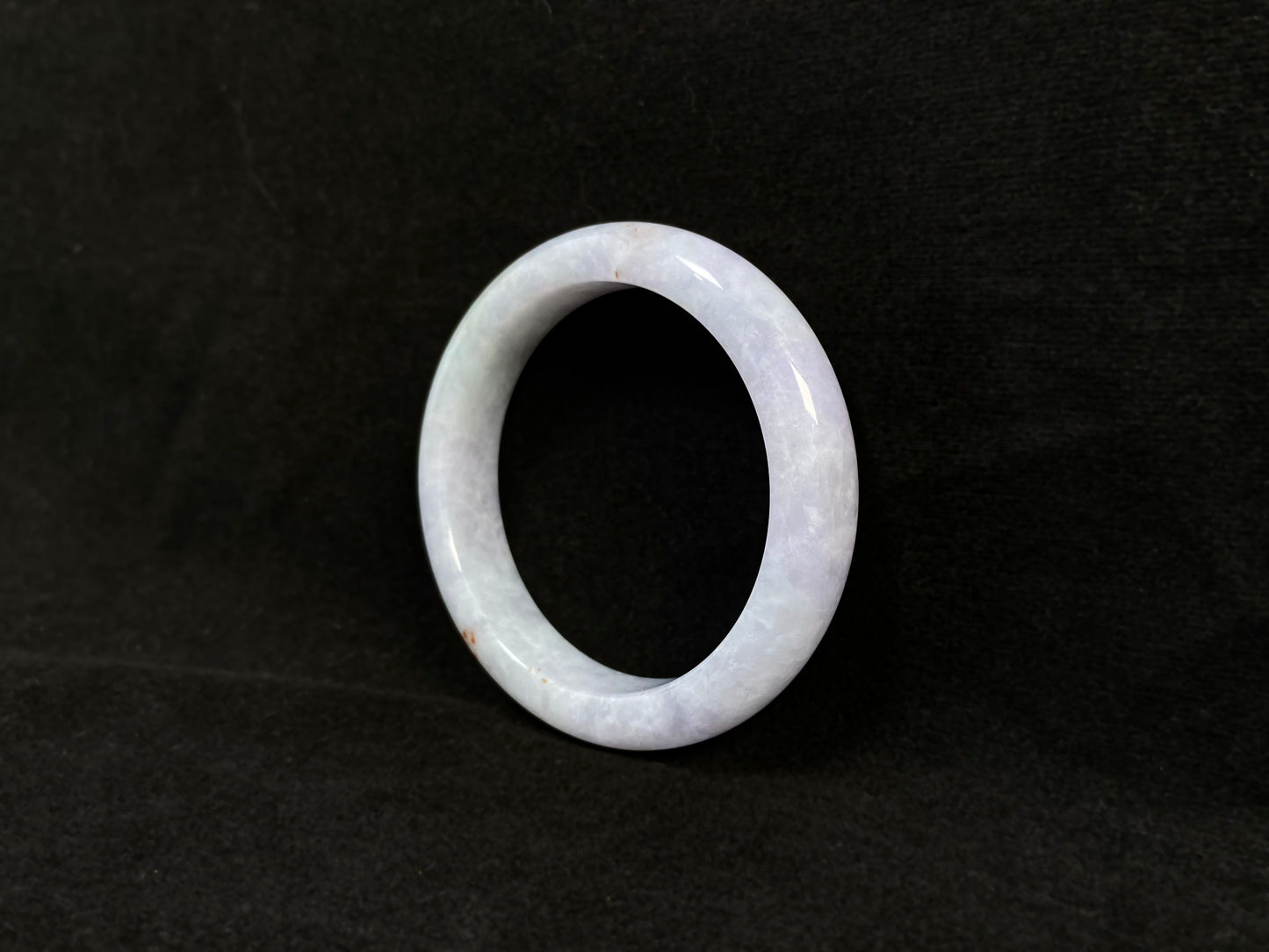 Pale purple jade gracefully mingled with white.