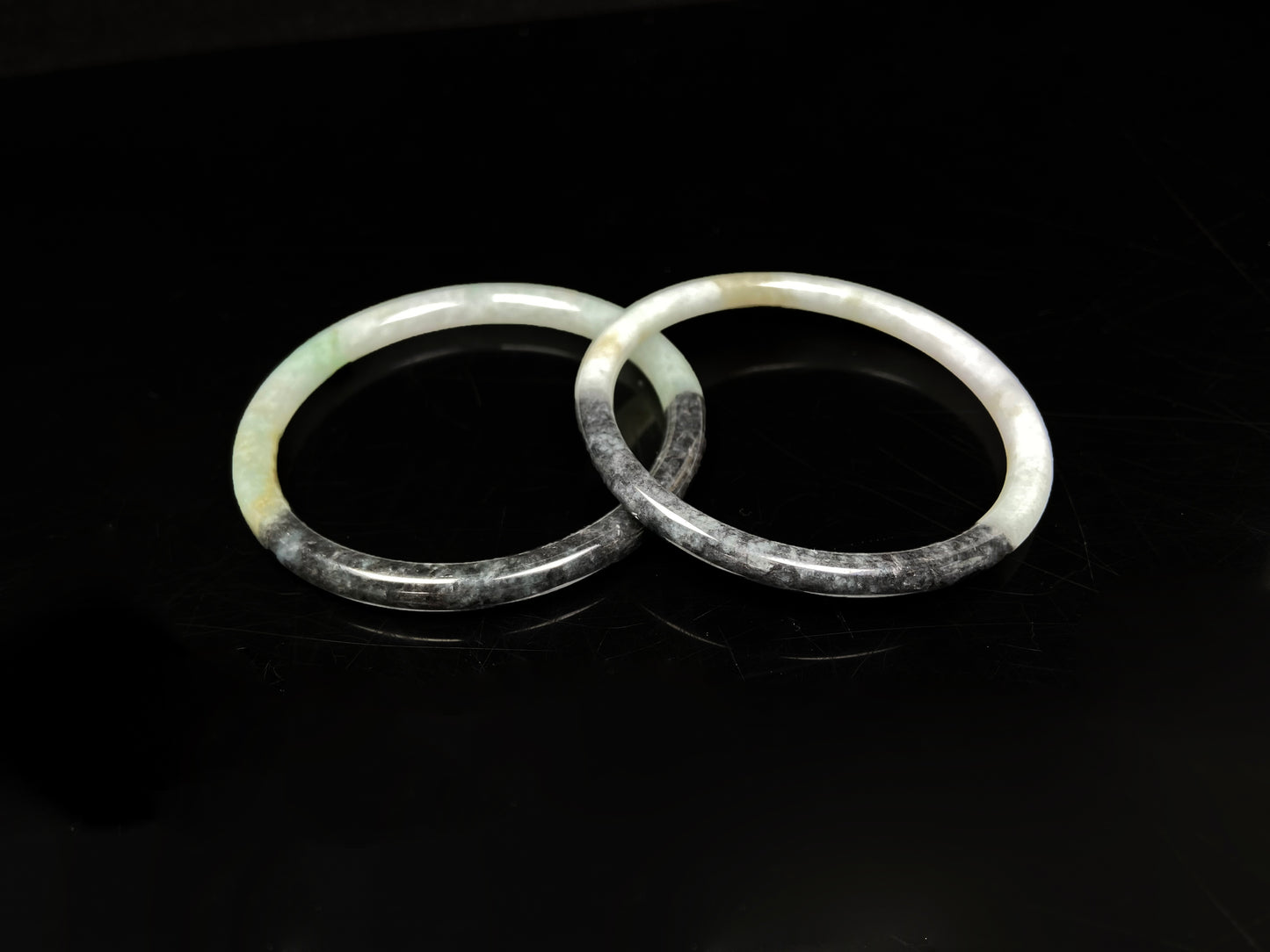 A tri color gradient haze pair jadeite bangle.