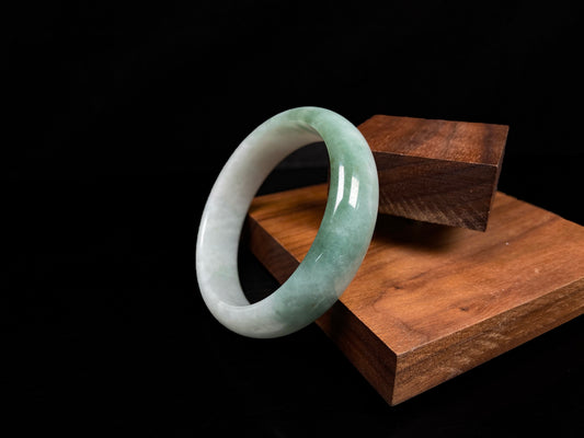 A fresh green with cloud white jadeite bangle.