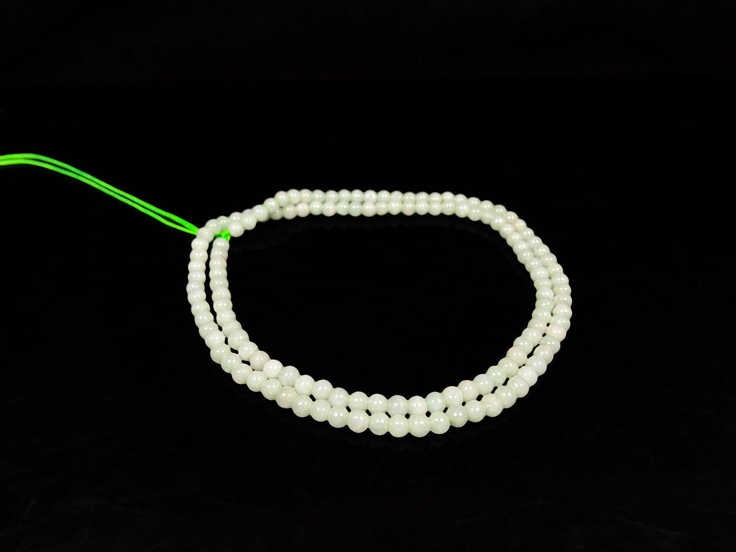 A soft milky green jadeite beads necklace.