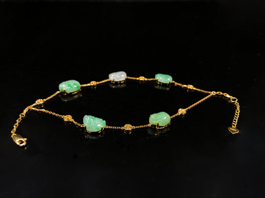 This bracelet is made with white Pixiu and green jadeite Pixiu.