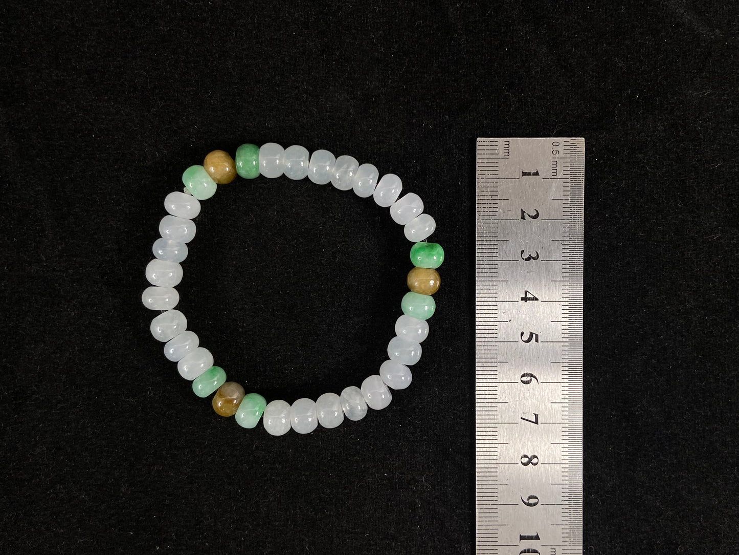 Crystalline beads with verdant and caramel hues.