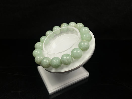 A apple green jade strand jadeite beads bracelet.