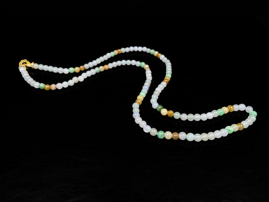 A soft glossy tri-color jadeite beads necklace.
