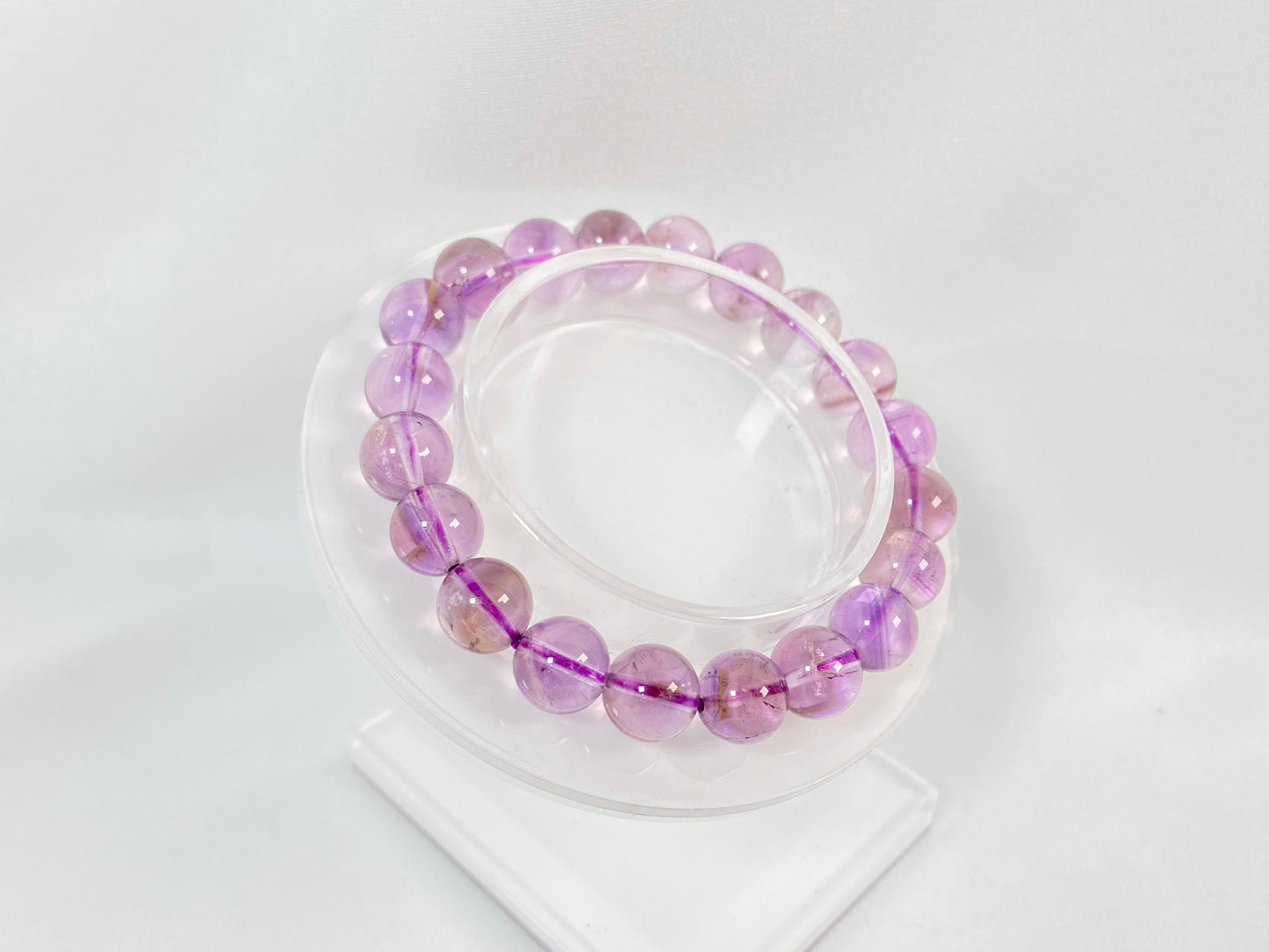 A bead strand crafted from ametrine crystals.