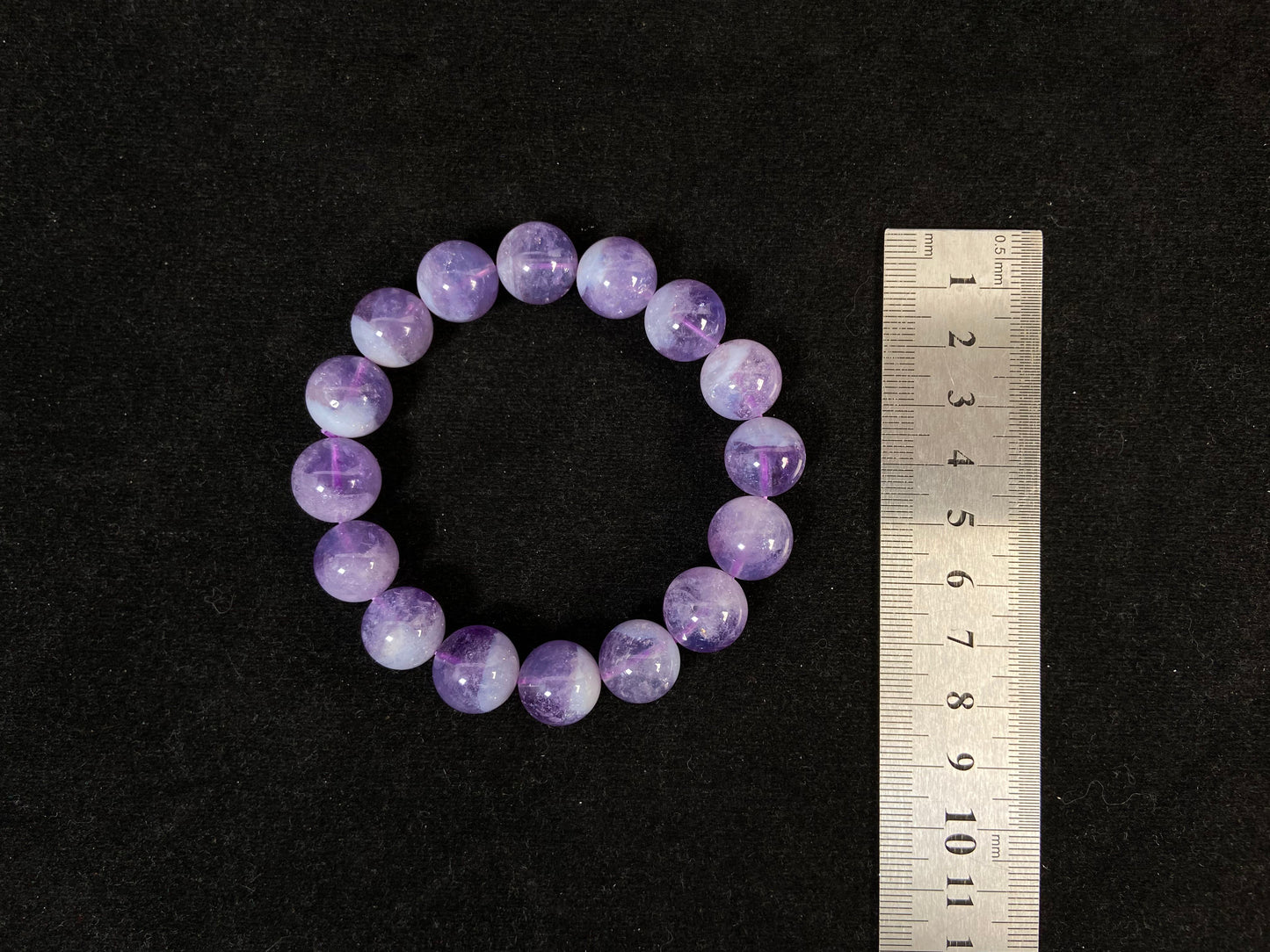 This bracelet features genuine amethyst beads.