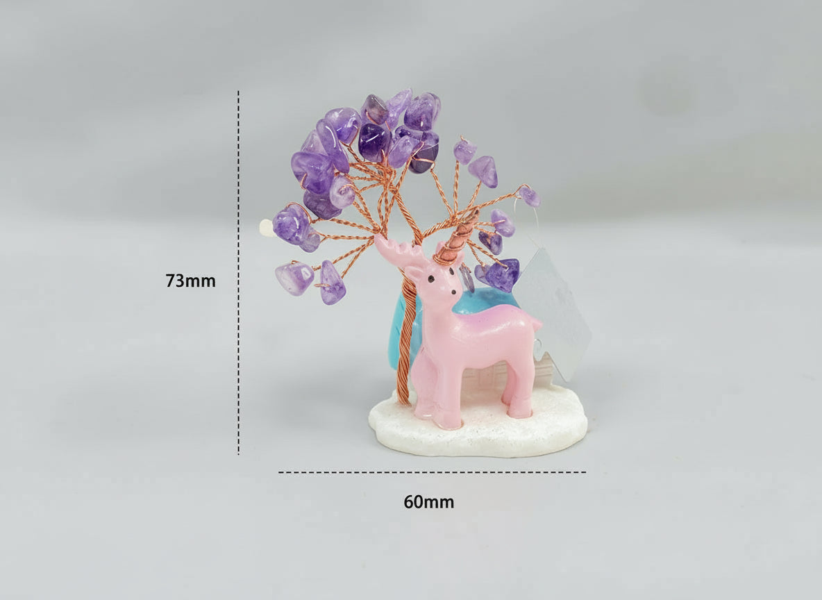 An amethyst crystal tree accompanied by a pink deer and a white cottage with a blue roof.
