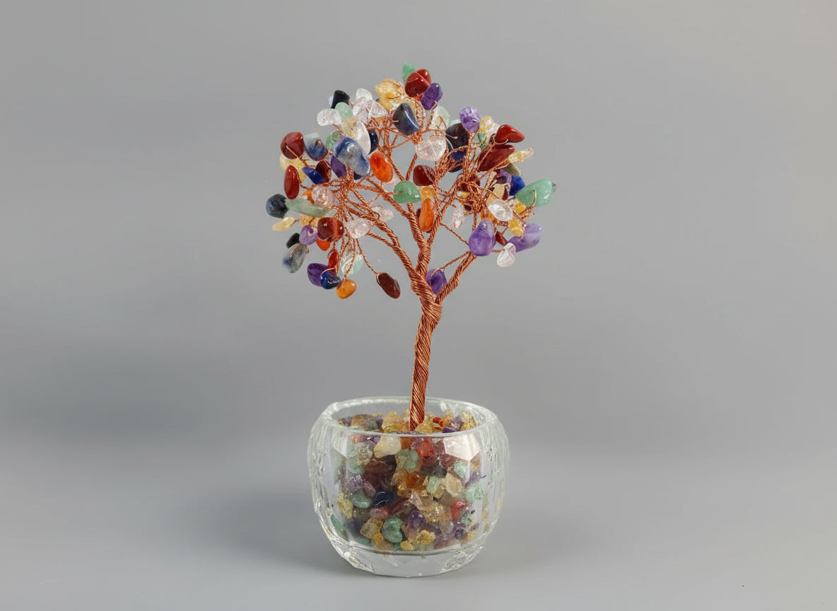 A crystal tree made with amethyst, citrine, green crystal, red crystal, and rose quartz.