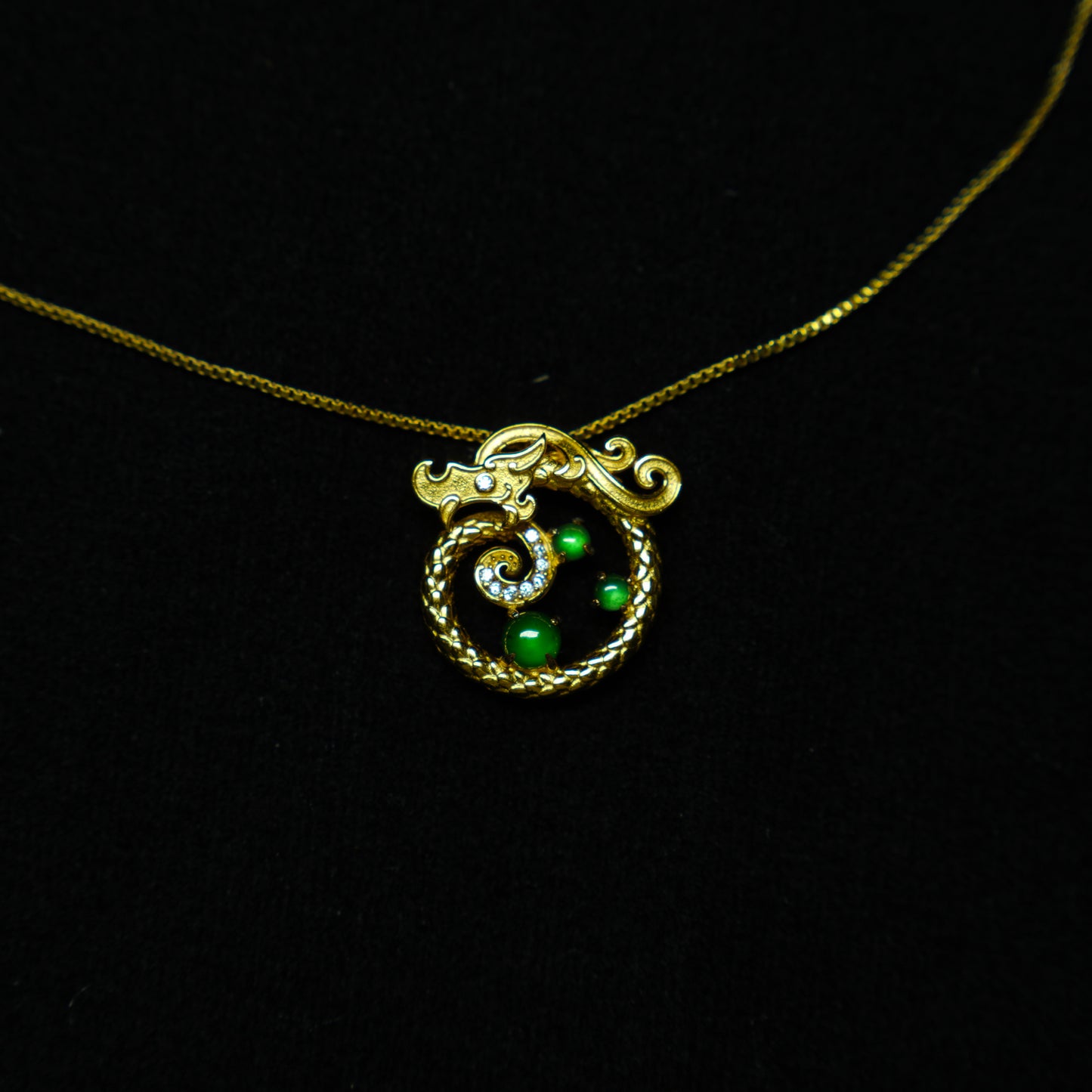 Dragon’s Blessing · Coiled Gold Dragon Pendant with Jadeite Orbs