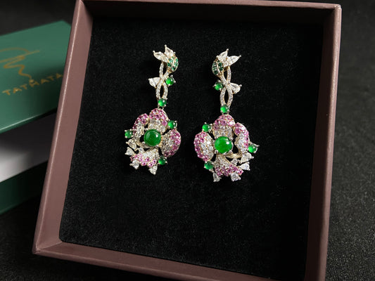 Floral earrings with green jade beads, featuring rose gold edges and silver bases.