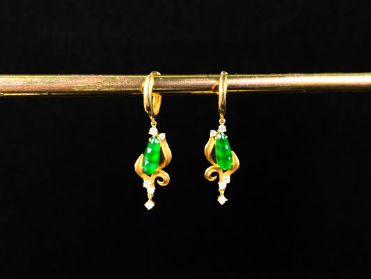 A pair of vivid green snap pea jadeite earrings.