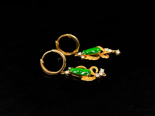 A pair of vivid green snap pea jadeite earrings.
