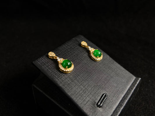 Imperial green jade beads set in gold plated silver with secure prong settings.