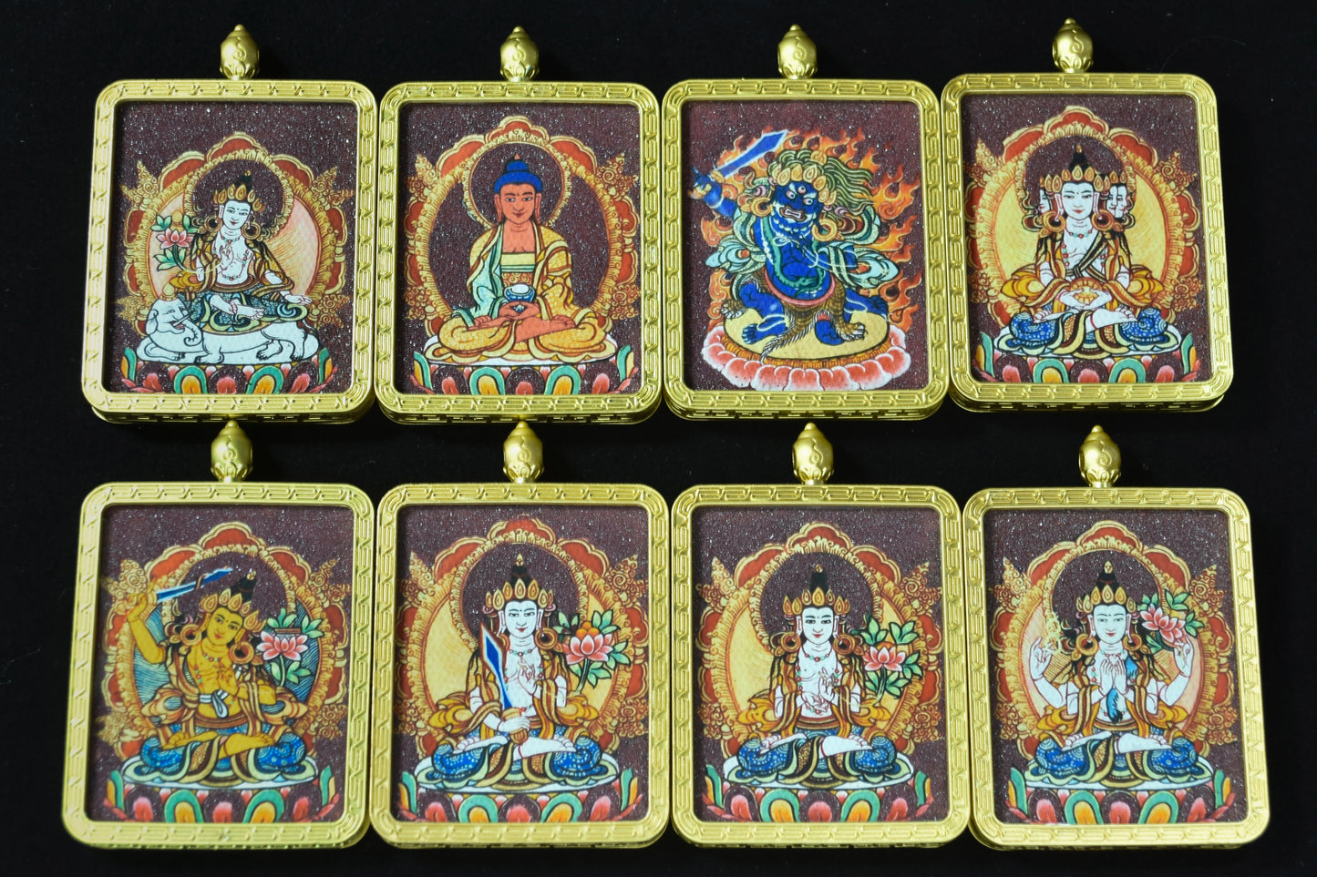 Set of eight colorful religious icons on a black background