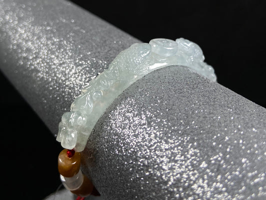 A icy half bangle red cord jadeite bracelet.