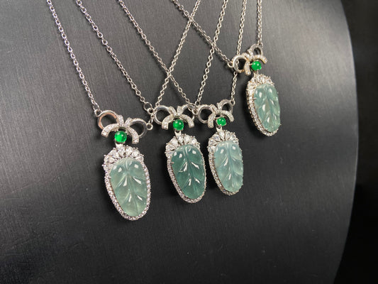 A lucky leaf with green bead jadeite pendant group.