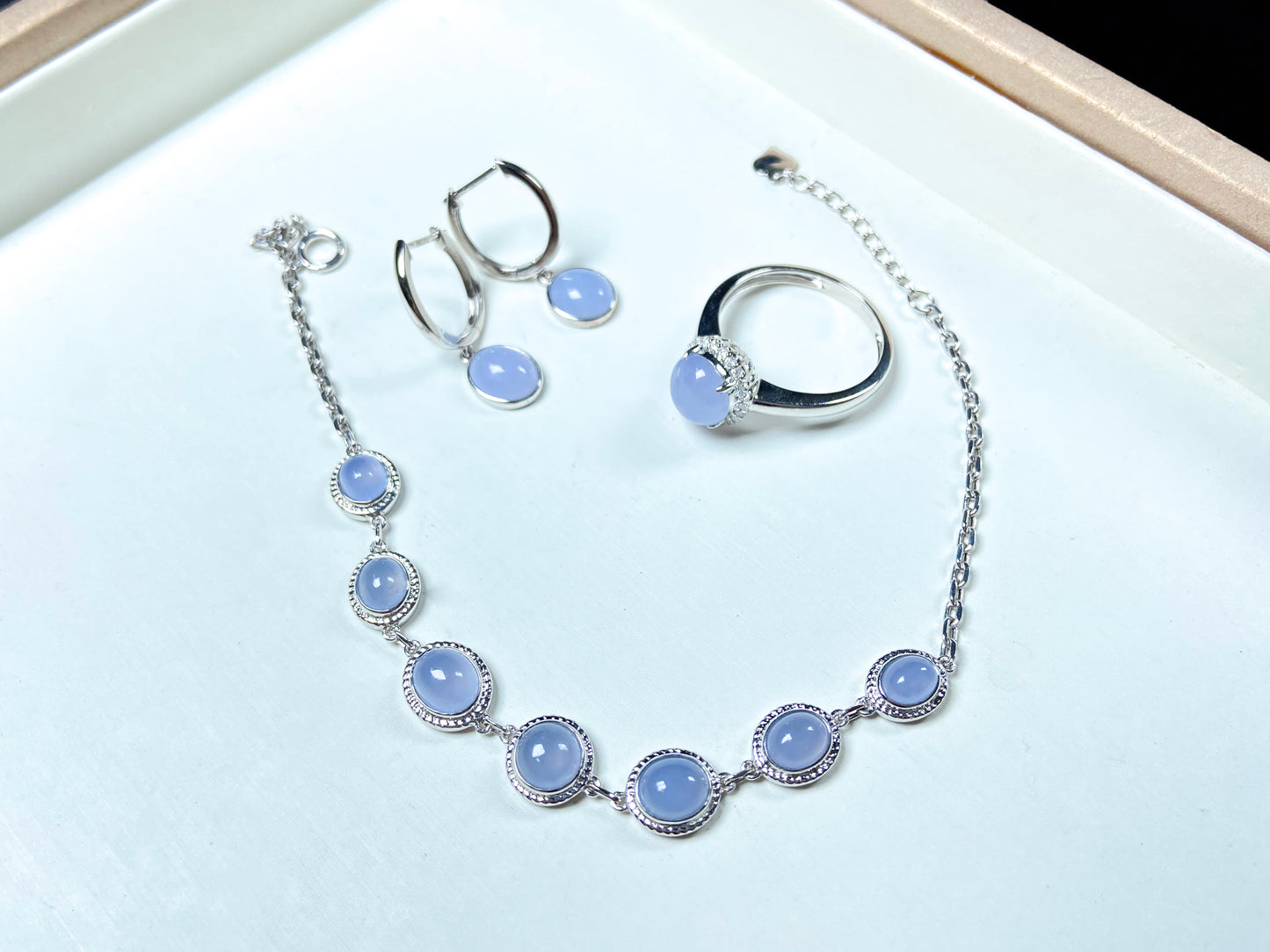 This is a purple jadeite ring, a purple jadeite necklace, and purple jadeite earrings.