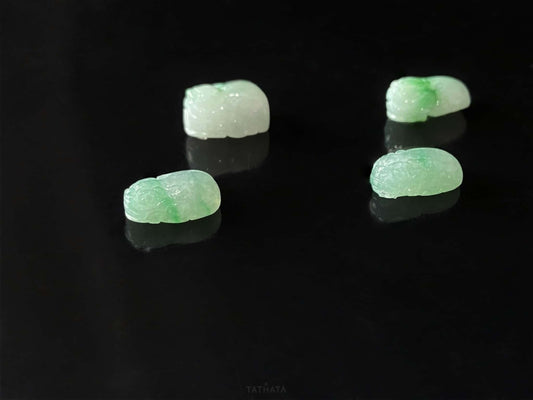 A green dot fortune Pixiu loose jadeite.