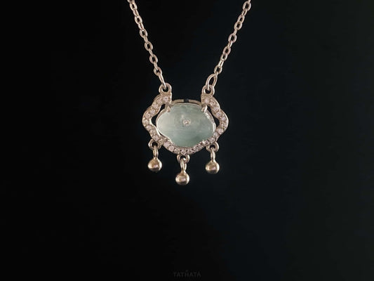 A ice green Ruyi chime jadeite pendant.