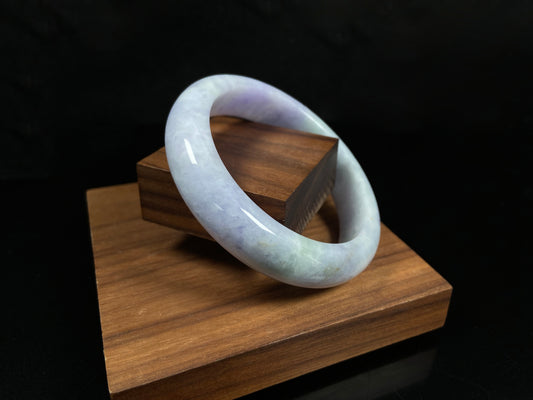 A pale lavender purple base with gentle green accents jadeite bangle.