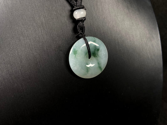 A icy green float round safety buckle jadeite pendant.