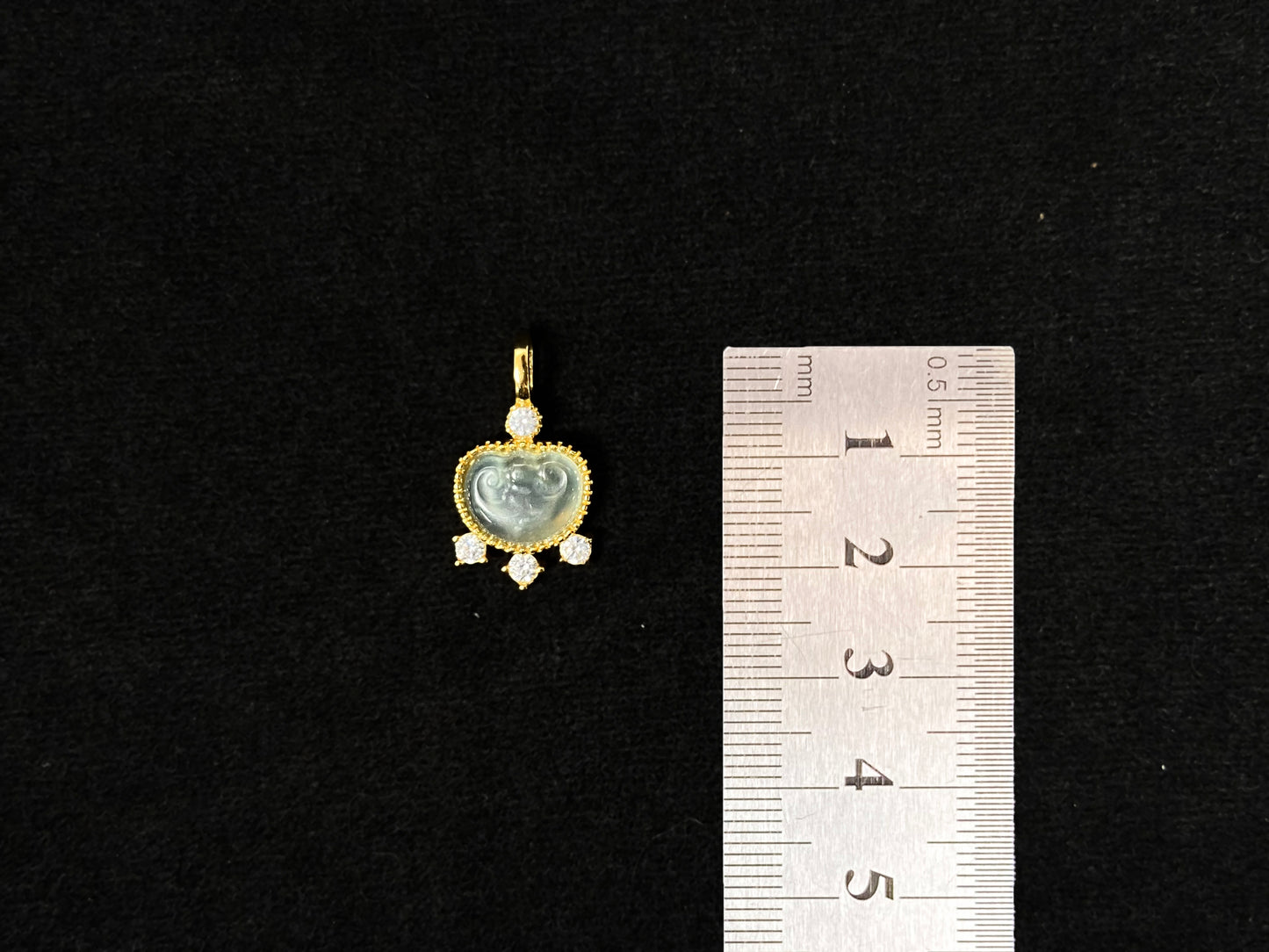 An icy jadeite ingot pendant with gold-plated 925 silver edges, set with three diamonds at the base and one on top.