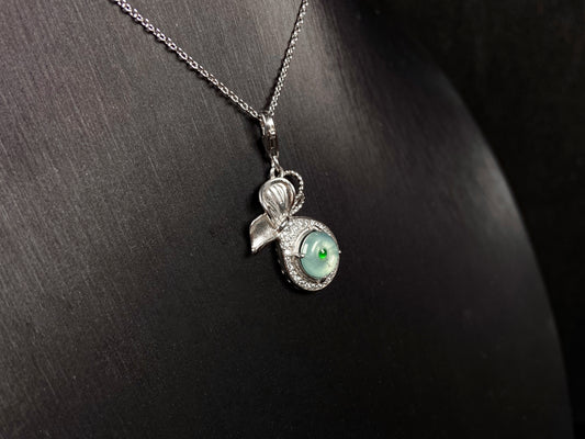 A icy green wealth pouch jadeite pendant.
