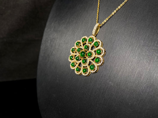 A filigree verdant cluster jadeite pendant.