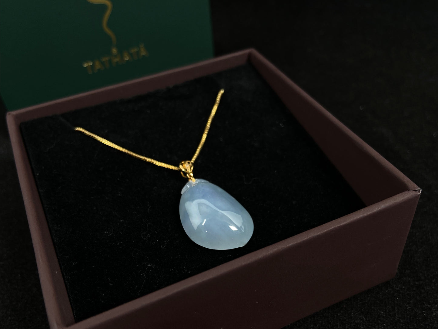 This translucent white jade peach pendant is elegantly complemented by a 925 silver gold plated clasp.