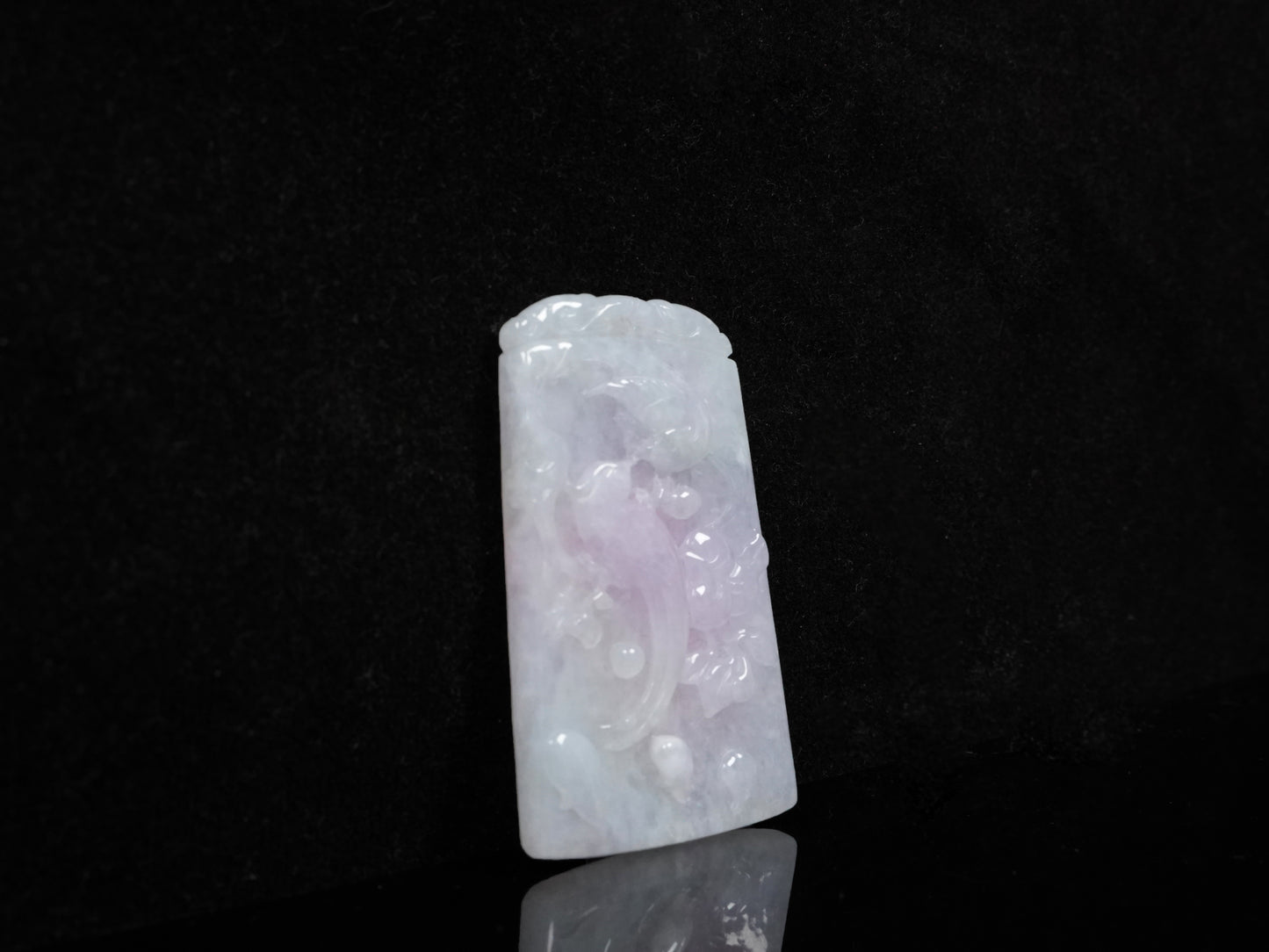 A lilac milky white base two magpies loose jadeite.