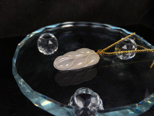A leaf warm yellowish white jadeite pendant.