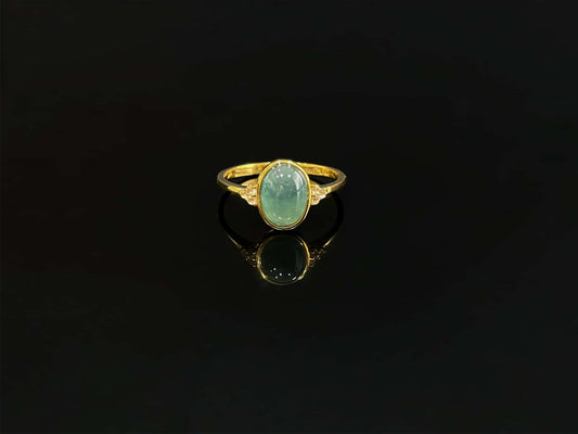 A lagoon blue-green jadeite ring.
