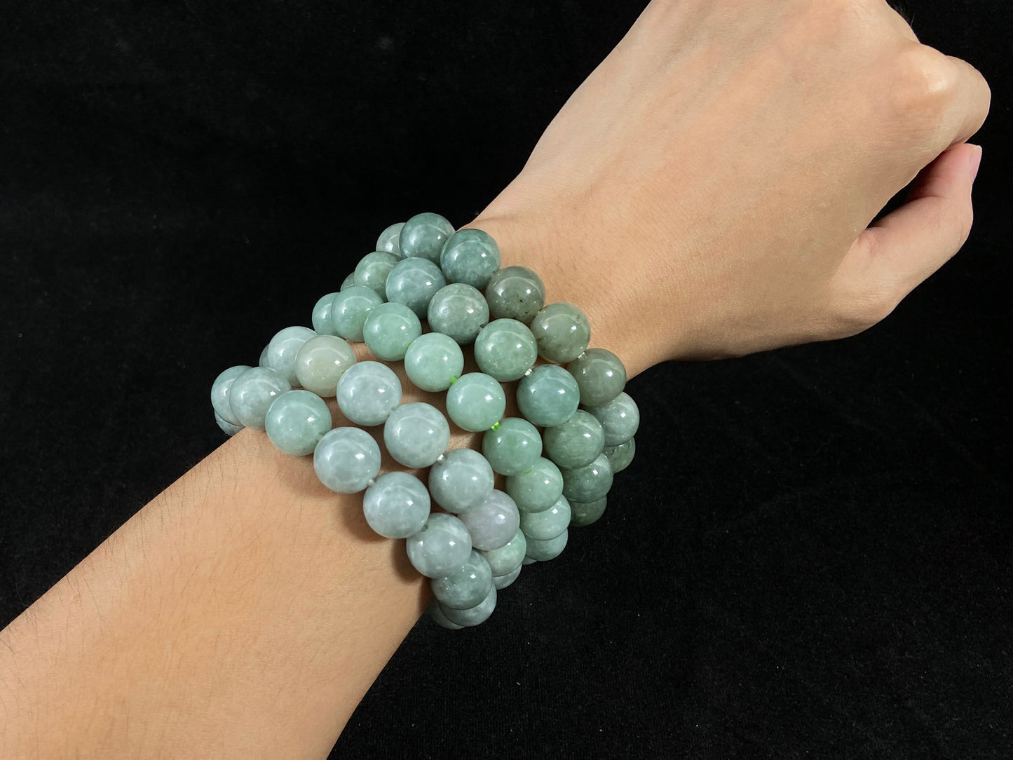 A jade bead strand with a blue base color.