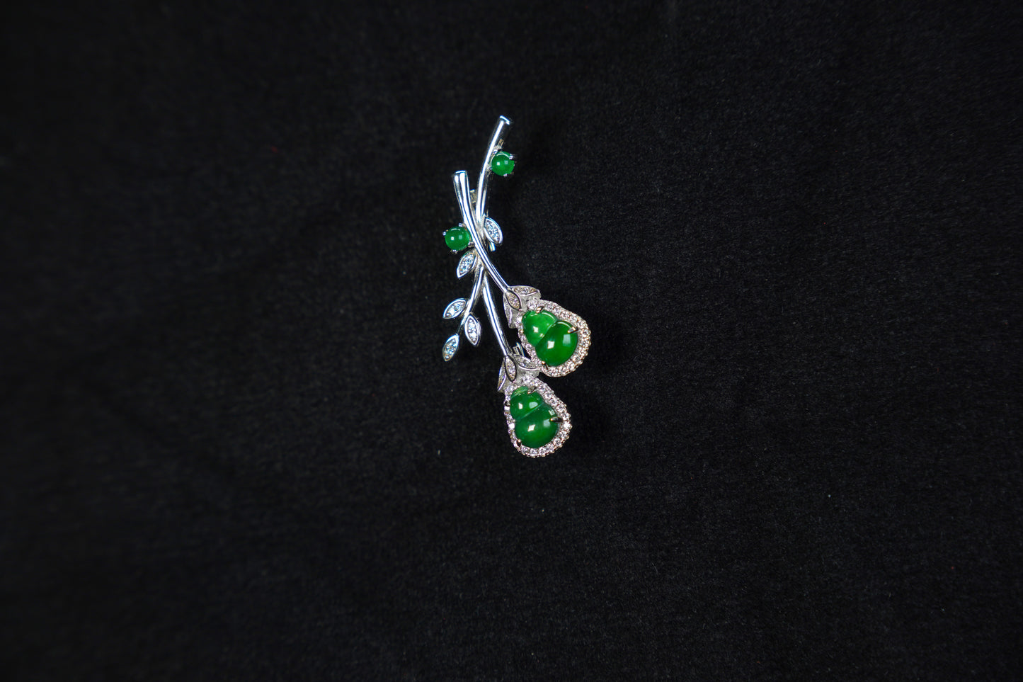 Jewelry with green stones on a black background