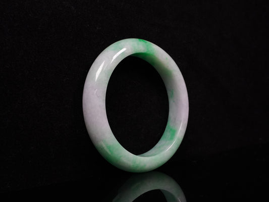 A lilac and viridescent bi-color gradient jadeite bangle.