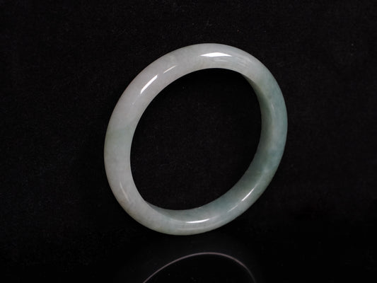 A mist green gentle luster jadeite bangle.