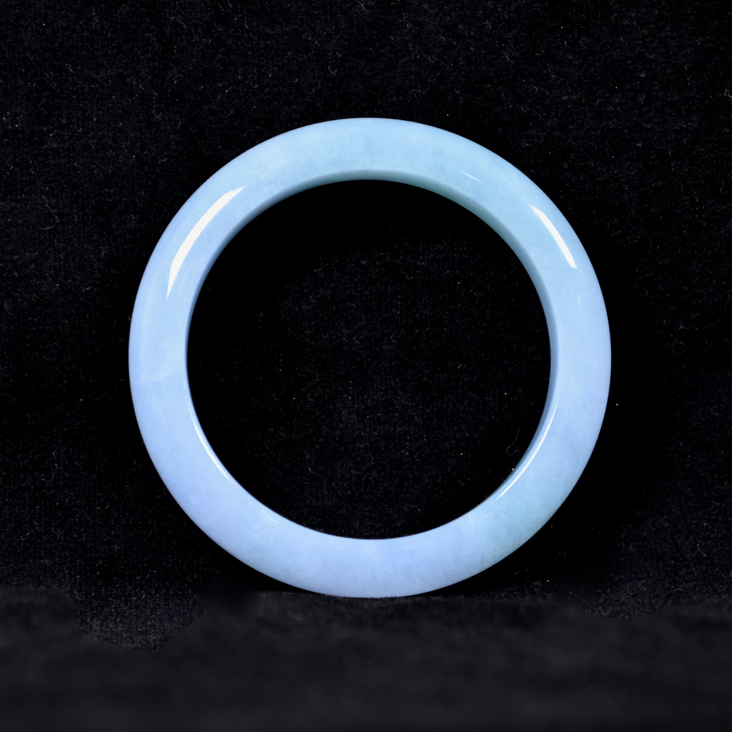 Translucent blue ring on a dark background