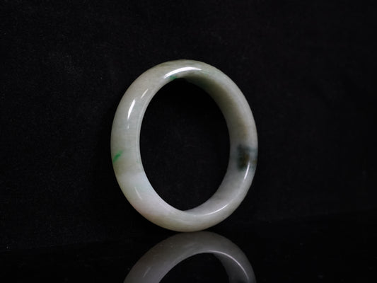 A soft greenish-aqua with natural veins jadeite bangle.