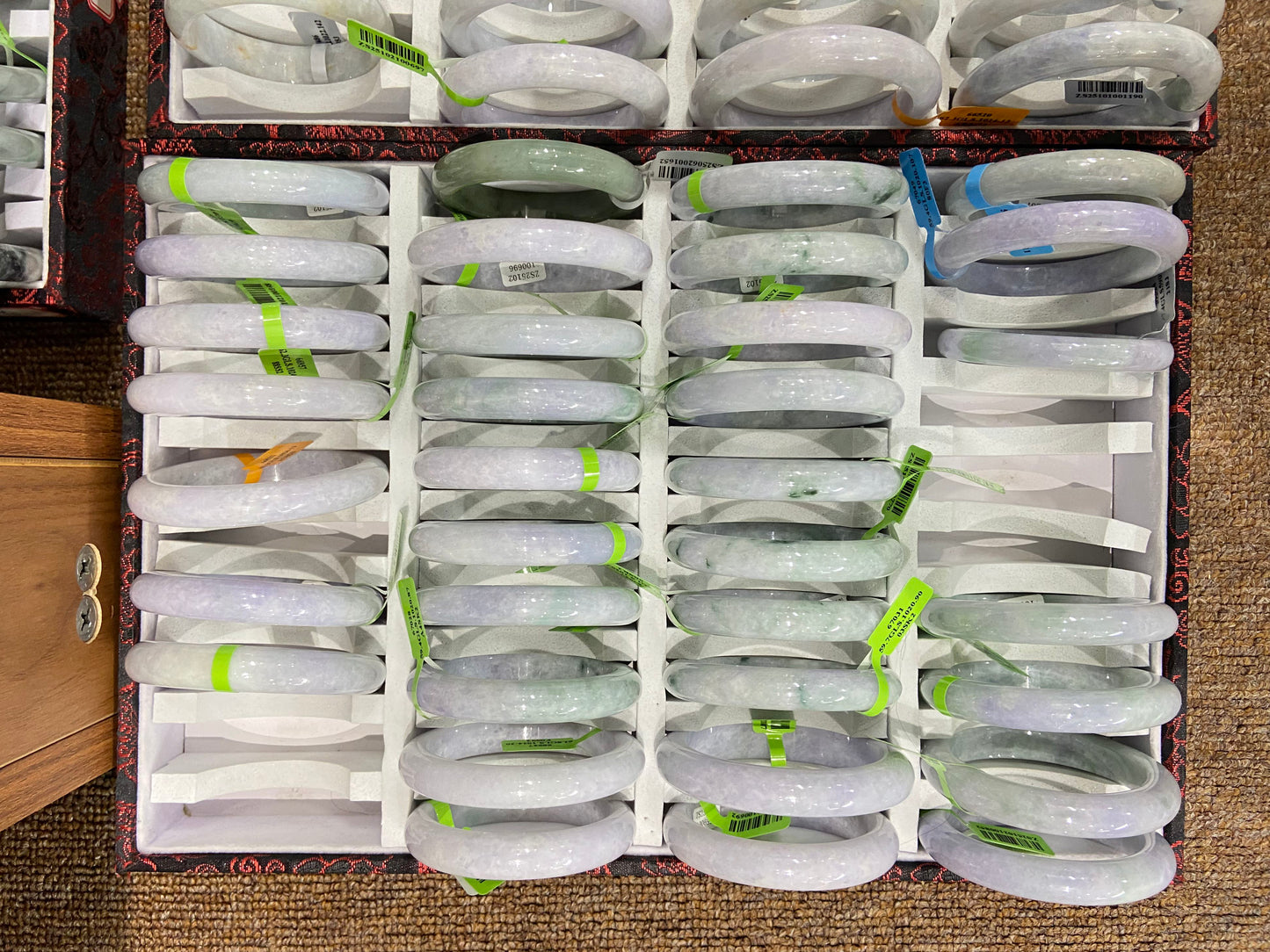 These purple and green bangles were carved from the same jadeite stone.