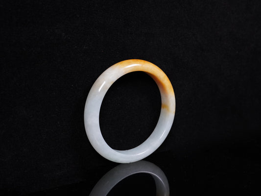 A ivory base with warm amber accent jadeite bangle.
